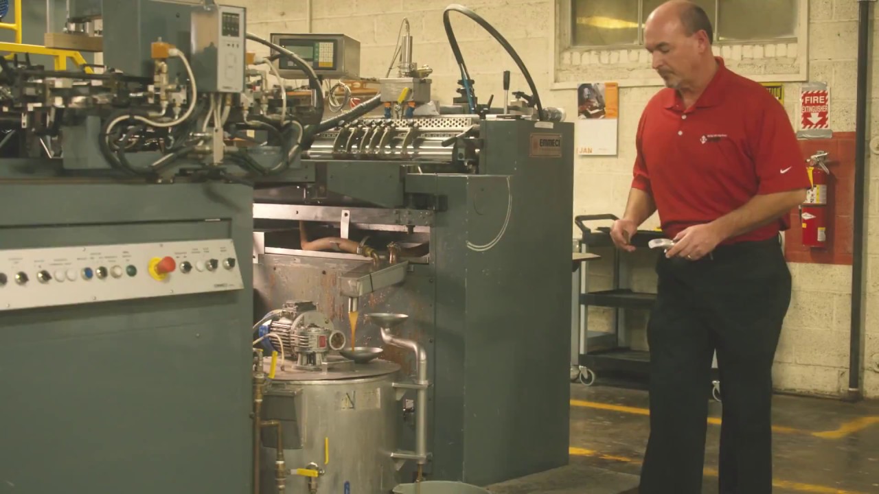 An LD Davis consultant runs tests on a gelatin glue machine